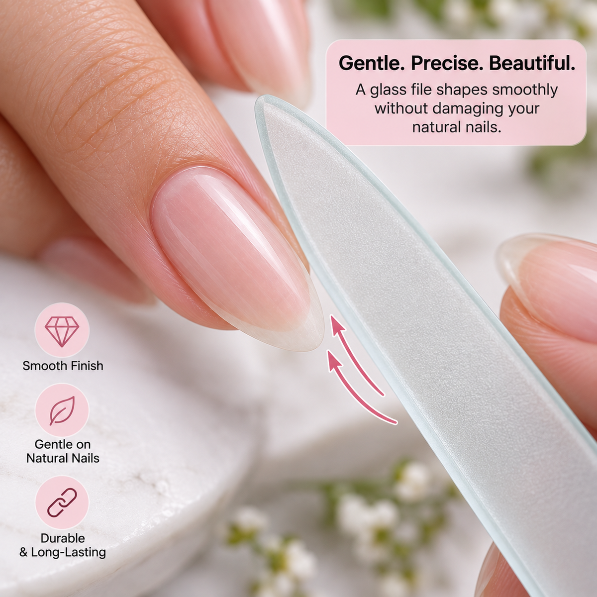 Translucent glass file gently precision shaping a natural almond nail tip.